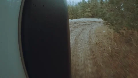 Shooting the movement of a car on an off-road surface on an action camera 스톡 동영상 320322003