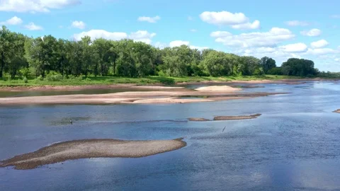 Shooting over a shallow part of the river and over sandy islets. Stock Footage 119073156