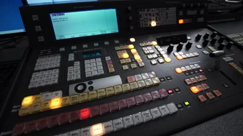 Shooting With a Panorama of the Telebroadcasting Console Lights in Dark Studio Video stock 61495895