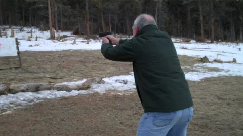 Shooting a pistol Stock Footage 605192