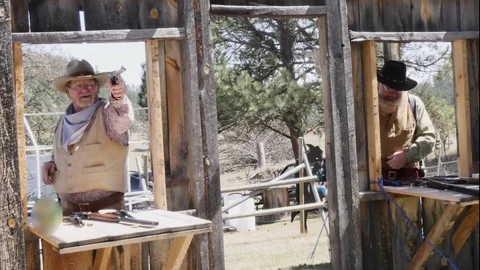 Shooting practice with .22 semi auto and shotgun Stock Footage 74625010