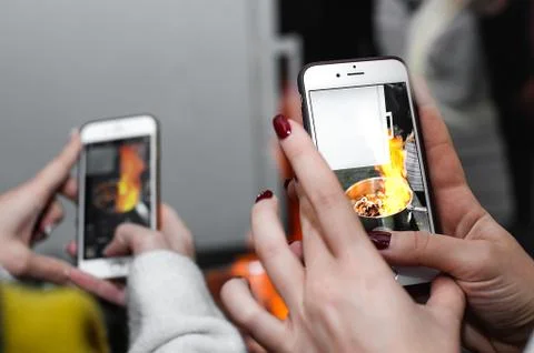 Shooting the process of cooking on a smartphone Stock Photos
