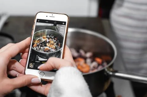 Shooting the process of cooking on a smartphone Stock Photos