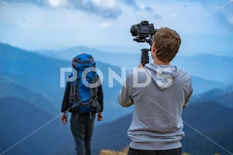 The shooting process with men on the mountain Stock Photos