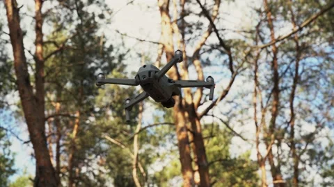 Shooting a quadcopter soaring in the air Stock Footage 154868116