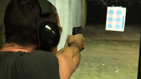 Shooting range with 9mm in slowmotion Stock Footage 106050519