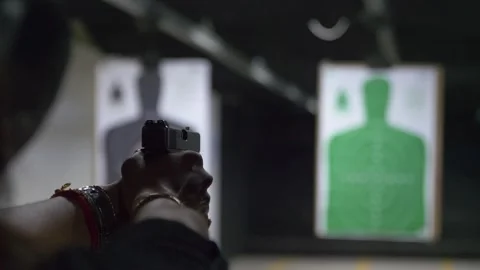 Shooting range practice. Slow motion of woman firing handgun doing a slide Stock Footage 281342351