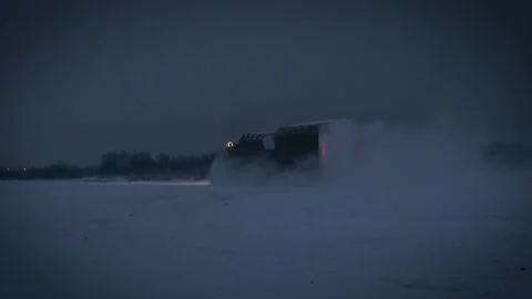 Shooting range Russia.Military tractor machine moves along a snowy field at Stock Footage 115862582