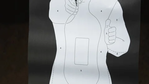 Shooting range target being shot with bullets at the bottom, closeup Vidéo 120749082
