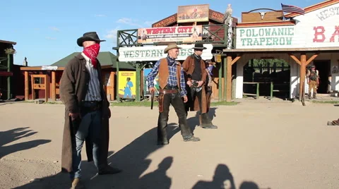 Shooting scene. Four gunslingers in action. American wild west Stock Footage