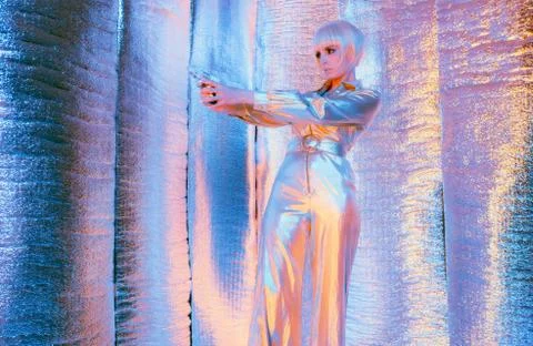 Shooting space war woman wearing jump suit and sunglasses. Standing in reflec Stock Photos