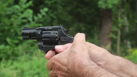 Shooting from a  starting pistol in forest Stock Footage 168577178