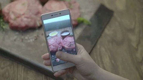 Shooting steaks on a mobile phone Stock Footage 79276494