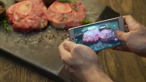 Shooting steaks on a mobile phone Stock Footage 79445284