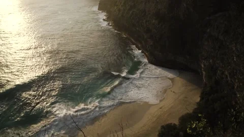 Shooting the sunset from the mountain along which the blue sea flows. Stock Footage 154160478