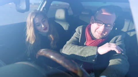 Shooting through windshield, young seductive Caucasian woman talking to Stock Footage 148764435