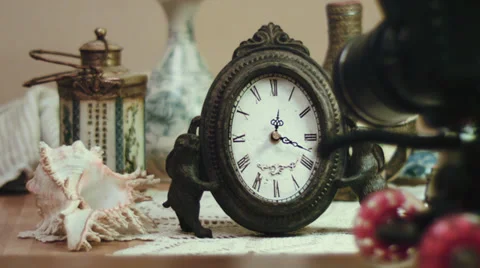Shooting time lapse with antique clock and sea shell, impressive technology Stock Footage 35586957