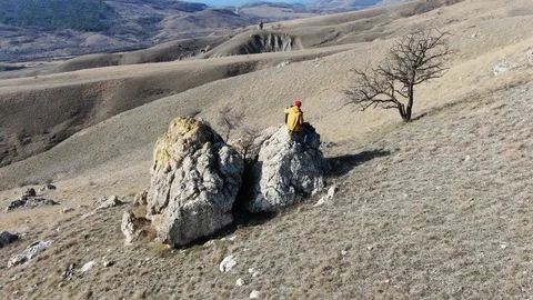 Shooting using a quadrocopter. Father with son on camp in the mountains Stock Footage 105025582