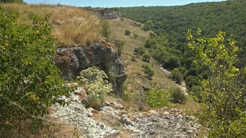 Shooting a valley from a mountain ledge. Stock Footage 80418212