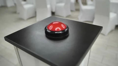 Shooting video around a big round red button. A game with a big red button. 動画素材 229556201