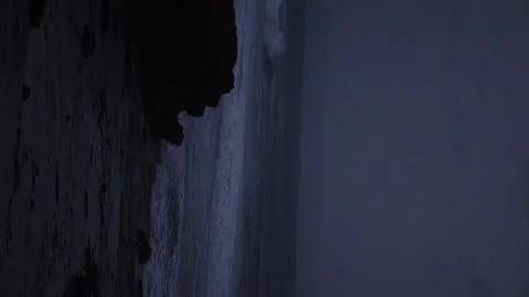 Shooting the waves of the night sea (vertical video). Stock Footage 155360348