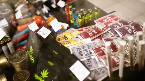 Shop display with CBD cannabis, hemp and marijuana products. Legal use of Stock Footage