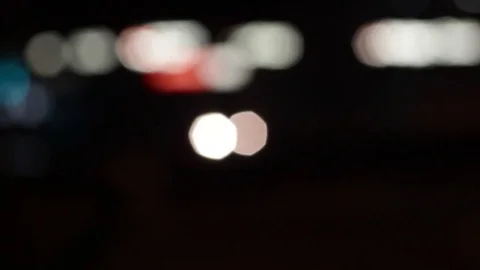 Shop light bokeh with flickering spots and moving headlights and brake lights Stock Footage 83800244