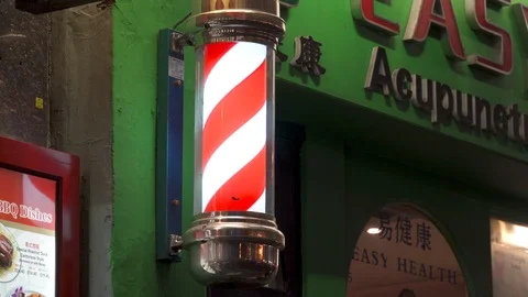 Shop lighted pole rotating signboard chinese medicine Chinatown London Soho Video stock 101276207