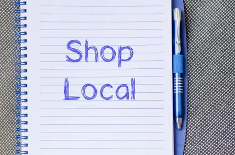 Shop local write on notebook Stock Photos