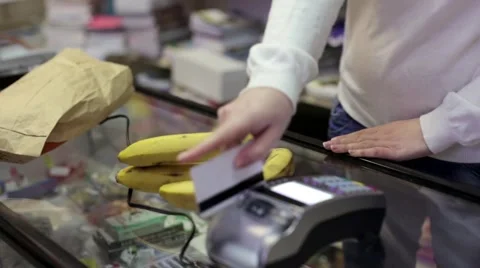 In the shop a man buys fruit Stock Footage 62142318