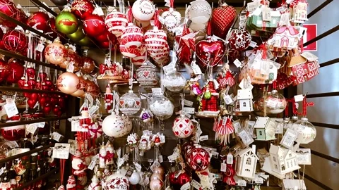 Shop showcase with red and white Christmas tree toy balls, dolls, nutckrackers Stock Footage 166755542
