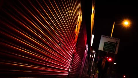 Shop Shutter at night reflecting traffic lights Stock Photos