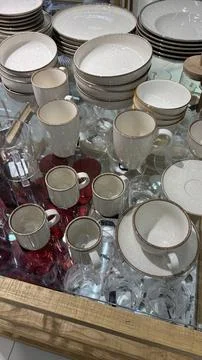 Shop window display featuring elegant dishes and tableware Stock Photos