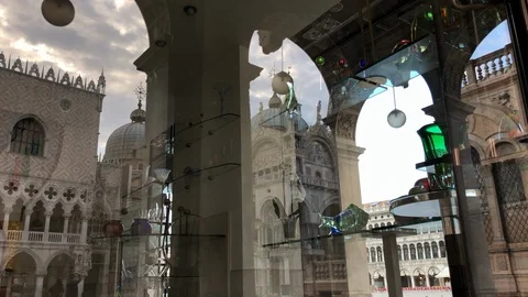 A shop window reflection of  of Saint Mark's Basilica in Venice Italy Video stock 90096409