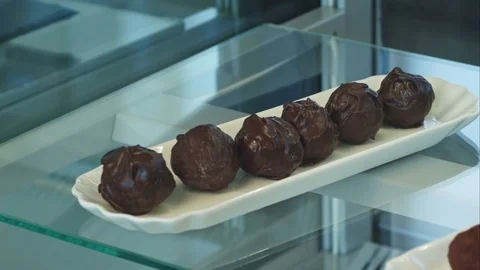 Shop window with stacks of chocolate sweets 스톡 동영상 77423856