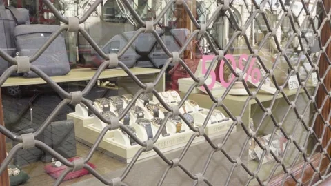 Shop window with watches of a closed store in a city during the coronavirus Stock-Footage 138024983