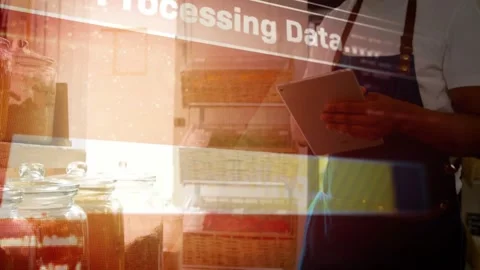 Shop worker reaching jars and tapping tablet, starting Processing Data overlay Stock Footage 333962196