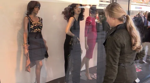 Shopaholic looking at clothes Stock Footage 33734109