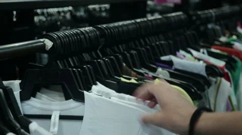 Shopaholic looking for tshirt Stock Footage 60935316