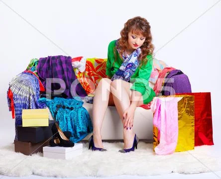 Shopaholic woman with purchases Stock Photos