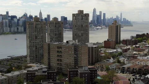Shopfronts below hillside homes above the Hudson in Weehawken, New Jersey Stock Footage 107112047
