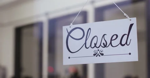 Shopkeeper opens shop by turning open sign. Shot on RED Epic. Stock Footage 59738217