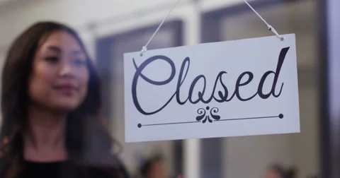 Shopkeeper opens shop by turning open sign. Shot on RED Epic. Stock Footage 59738347