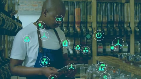 Shopkeeper tapping tablet and activating animated green icons while checking 스톡 동영상 332901949