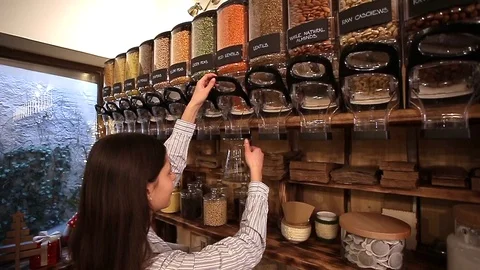Shopkeeper working in zero waste shop. Stock Footage 101475417