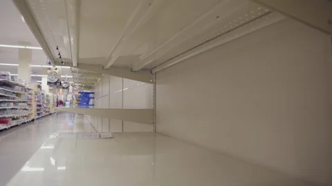 Shopper During Corona Virus Outbreak Passes Empty Shelves From Consumer Panic Stock Footage 127012102