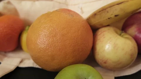 A shopper of fruit on table Stock Footage 130535559