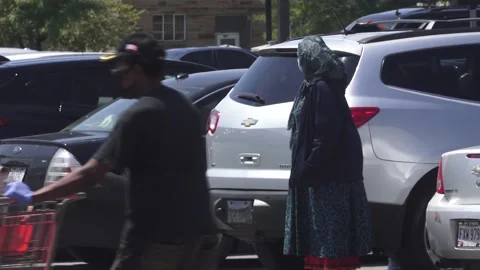 Shopper in mask by car Stock Footage 134500127