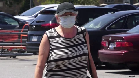 Shopper at retail establishment, in mask Stock Footage 134500456