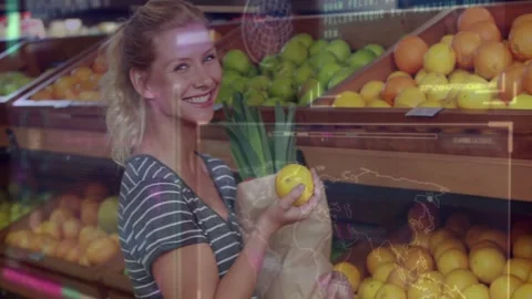 Shopper scanning grocery, selecting citrus, inspecting for purchase while HUD Stock Footage 332936960